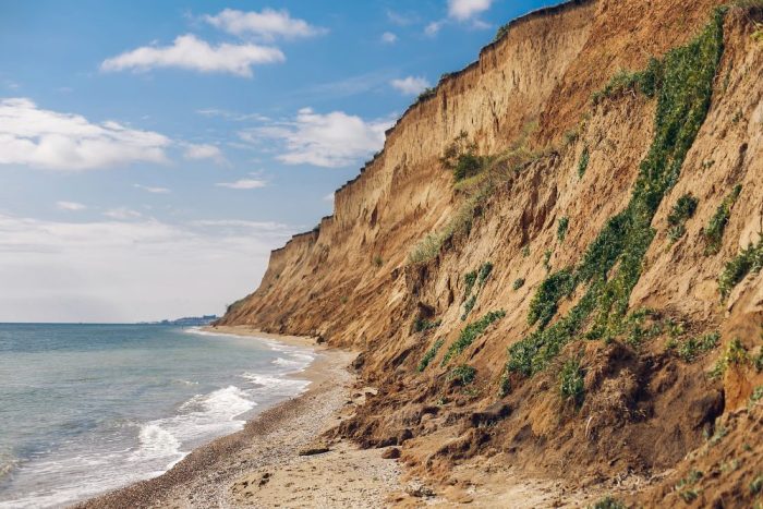 beautiful-view-of-sandy-cliff-near-sea-beach-2023-11-27-05-11-07-utc